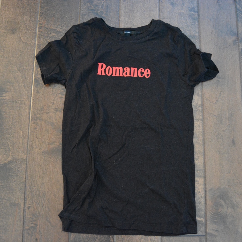 Black t-shirt, red writing, "ROMANCE"